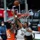 Giannis Antetokoumnpo blocks DeAndre Ayton to preserve the lead.